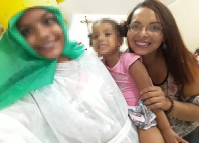 Josimare ao lado das filhas