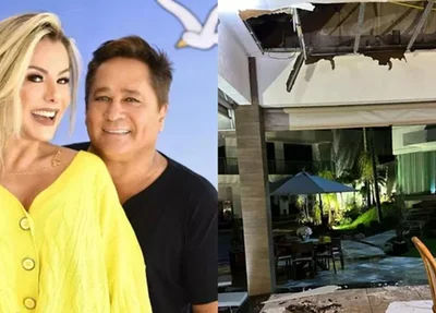 Cantor Leonardo e sua esposa, e a esquerda, parte do teto da casa que desabou