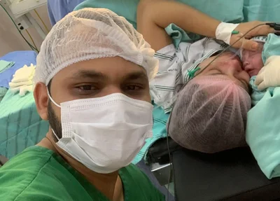 Lucas Pereira ao lado da mulher e do primogênito