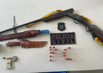Arma apreendida com o suspeito
