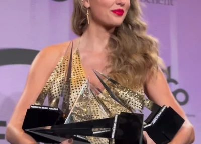 Taylor Swift com os 6 prêmios recebidos na 50 edição do AMAs