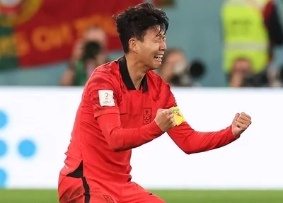 Jogador da Correia do Sul comemorando classificação na Copa do Mundo