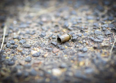 Cápsula de bala deflagrada após o disparo de arma de fogo