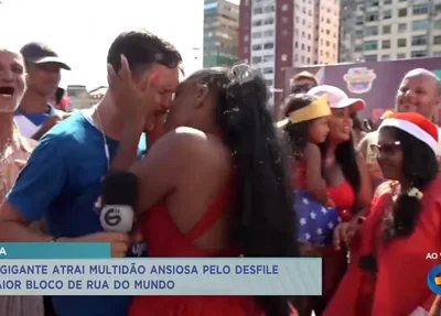 Momento em que mulher beija repórter da Tv Guararapes à força