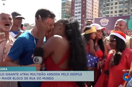 Momento em que mulher beija repórter da Tv Guararapes à força