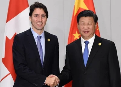 Primeiro-ministro do Canadá em foto com Xi Jinping, ditador chinês