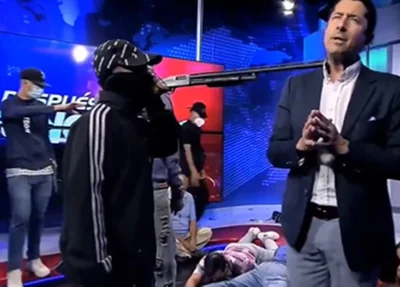 Criminosos fazem apresentador de refém ao vivo