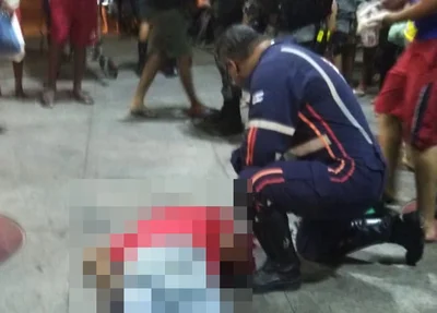 Segurança baleado, recebendo atendimento médico