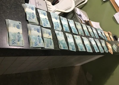 Dinheiro recuperado com o suspeito