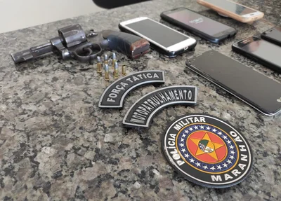 Arma de fogo e celulares apreendidos